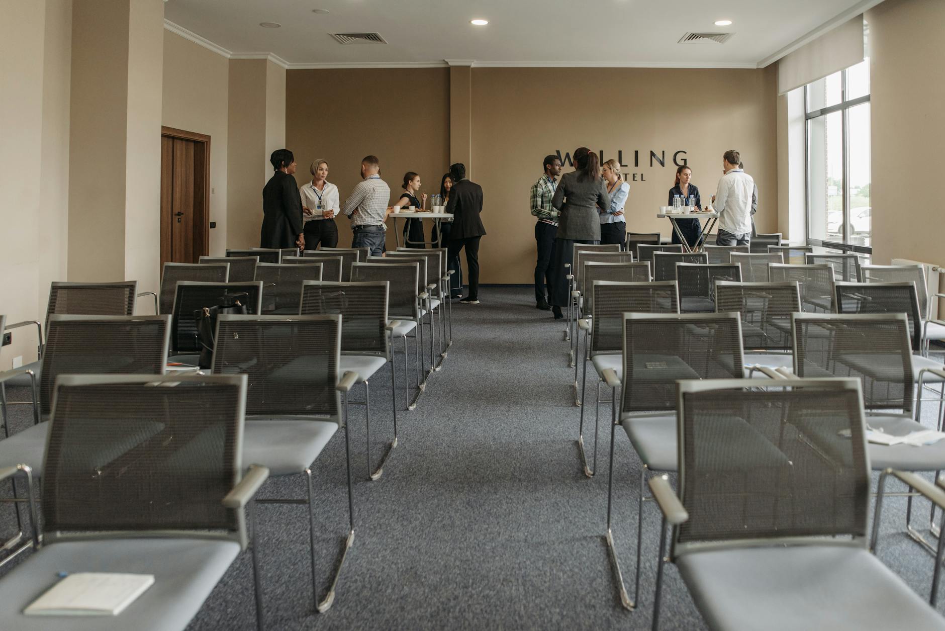 Business professionals networking in a conference room setting