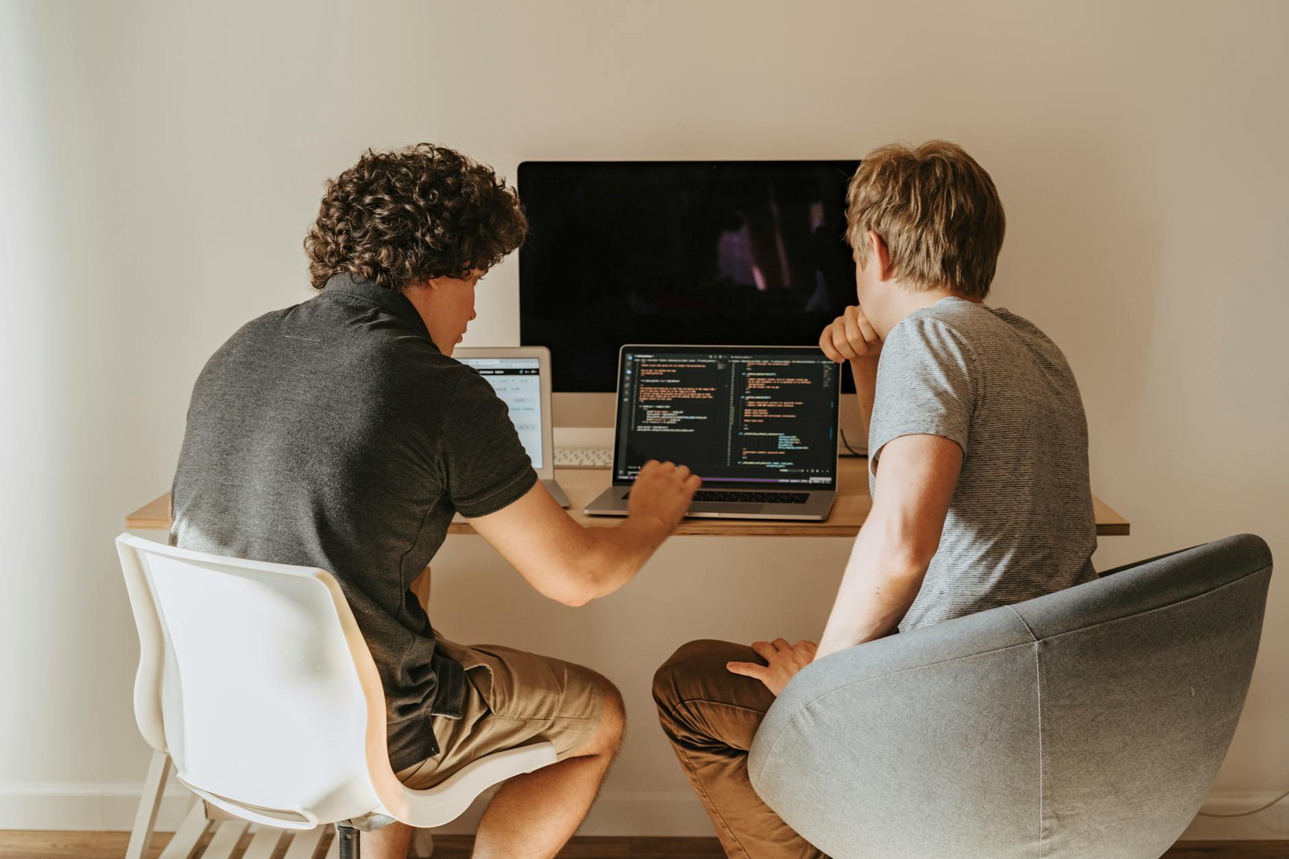Two engineers reviewing code together